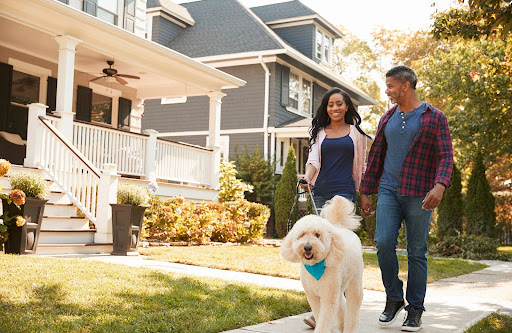 couple with a dog | rights of homeowners in an HOA