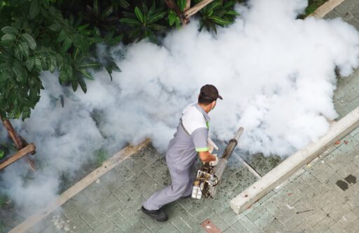 Professional exterminator doing fumigation | hoa pest control